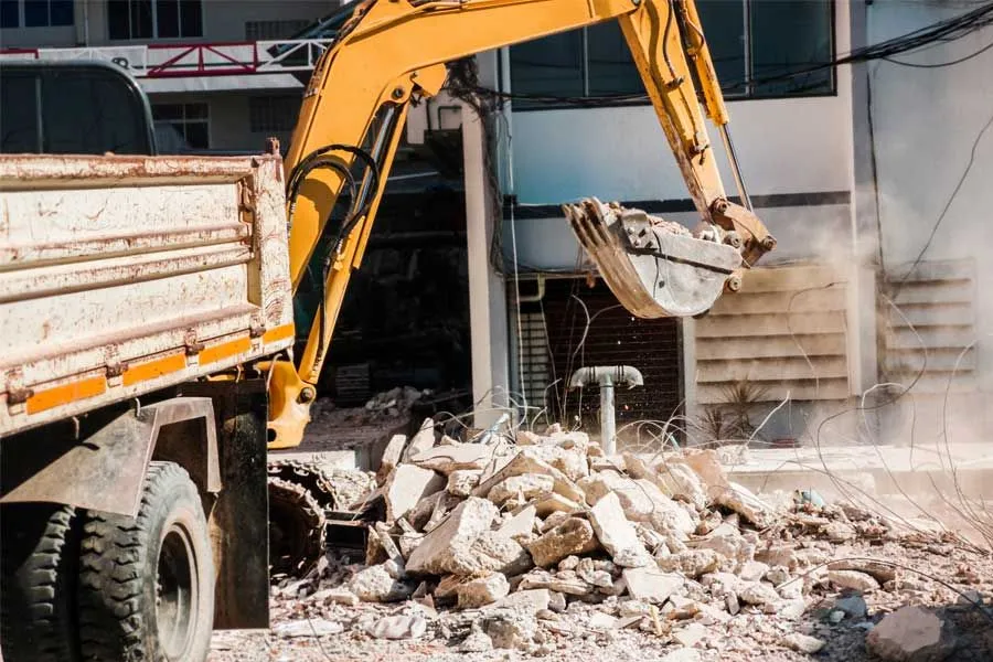 Professional cleanout specialist sorting debris in a Phoenixville, PA home to meet local health and safety standards