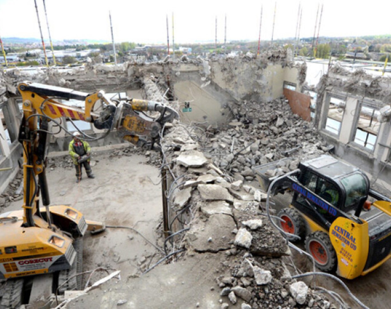 Experienced demolition team evaluating structure before controlled removal work starts