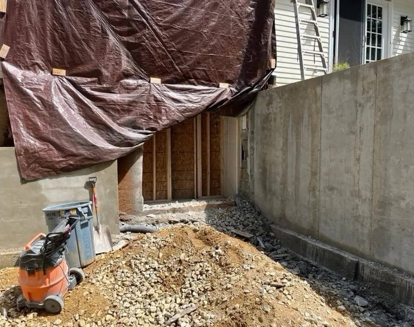 Crew removing damaged garage structure to prepare property for renovation