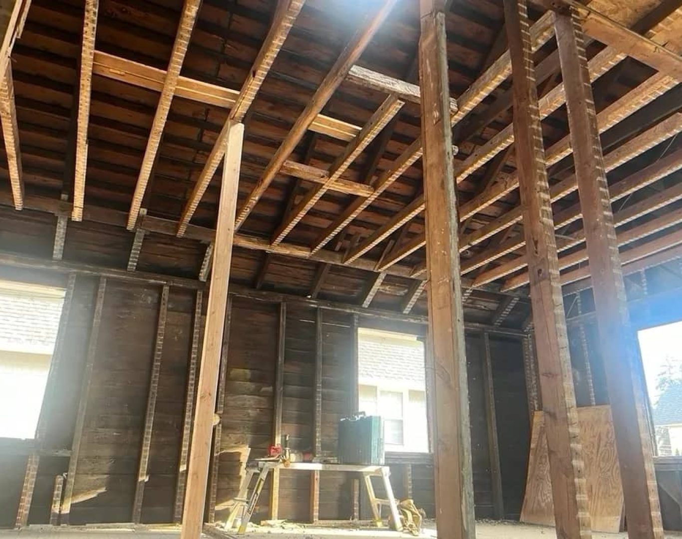 Experienced demolition crew using specialized equipment for controlled structural removal on site