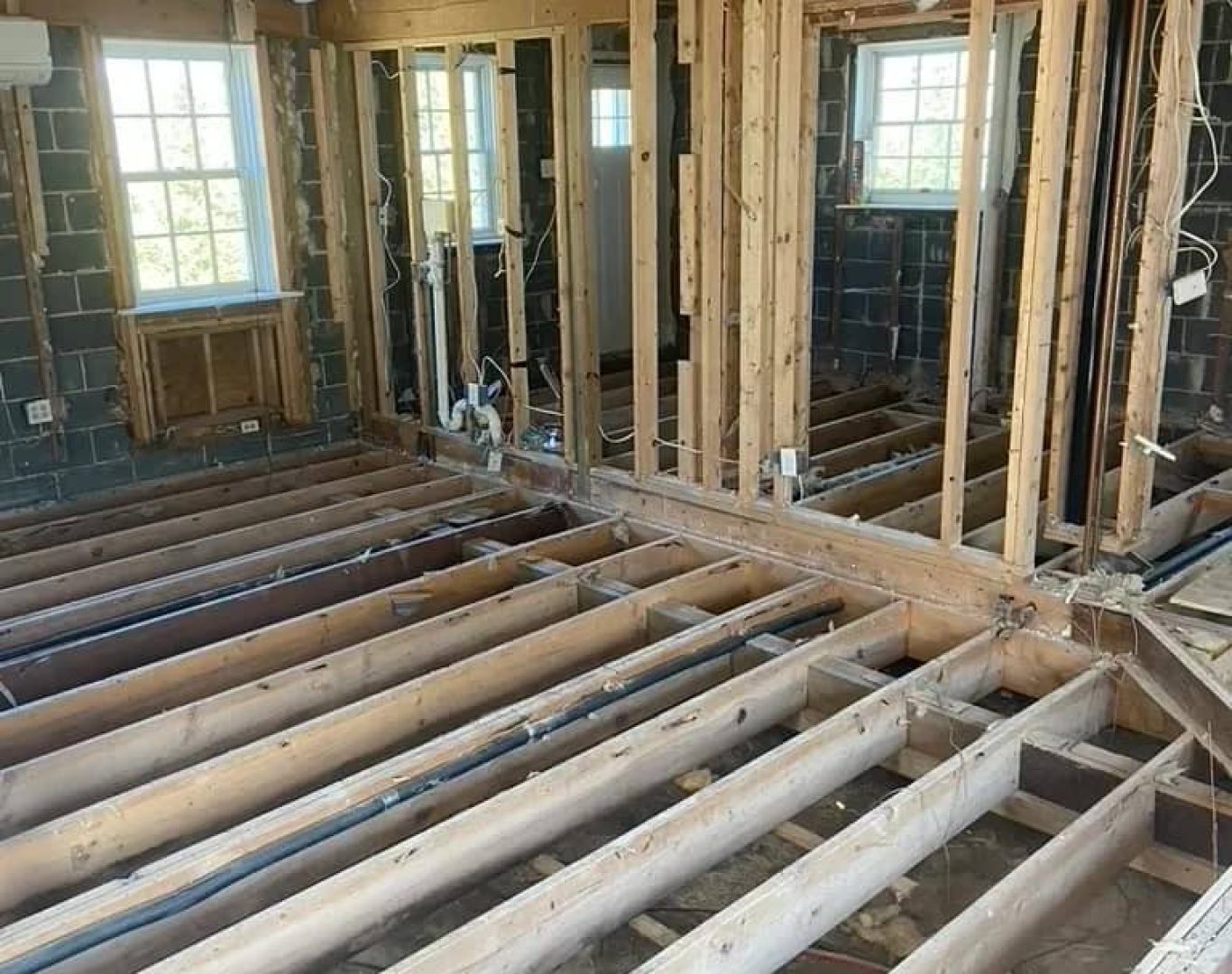 Experienced demolition team coordinating equipment and teardown sequence on site